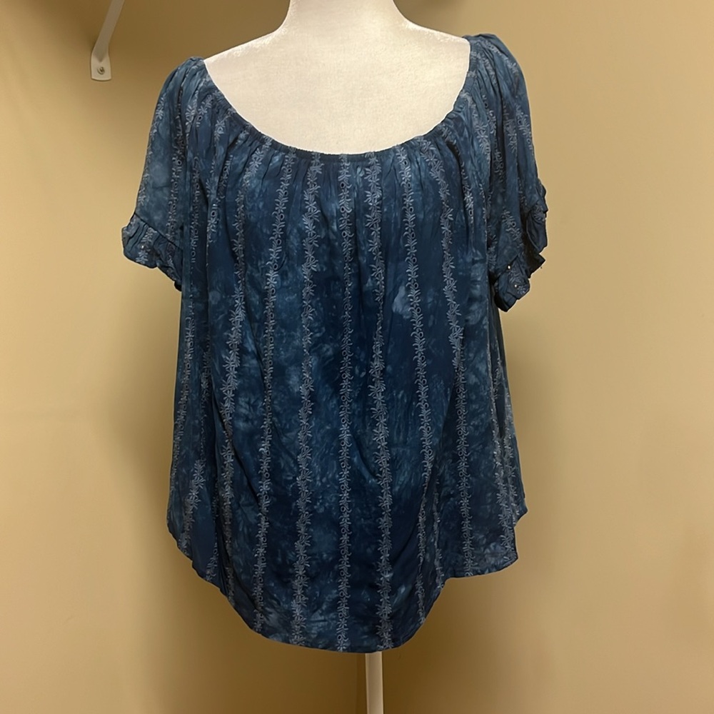 Top can be worn up on shoulders or down on arms. Lined.